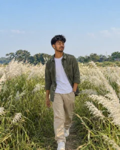 Person walking through a rural flower field