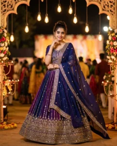 Man wearing a royal blue traditional outfit at a luxury Navratri night celebration